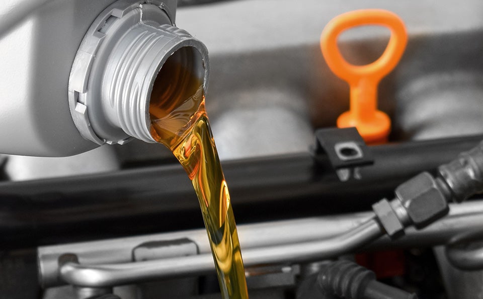Oil being poured into a car's engine